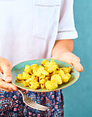 Cauliflower with honey and turmeric on plate