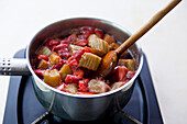 Prepare strawberry-rhubarb sorbet. Cook berries and rhubarb in saucepan
