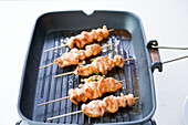 Salmon skewers on a grill pan