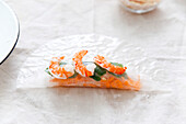 Preparing spring rolls with shrimp