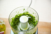 Prepare green minestrone with fish: Puree the mixture in a blender