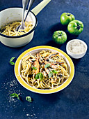 Linguine with breaded anchovies, green tomato sauce, basil and capers