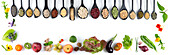 Row of wooden spoons full of seeds,cereals and dried vegetables and organic fruits and vegetables