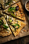 Goat's cheese,almonds and watercress pizza