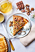 Epiphany cake with chocolate, walnuts, pistachios and whipped cream