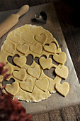 Cut out heart-shaped shortcrust pastry biscuits