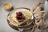 Pancakes with red fruits and hazelnut-chocolate spread