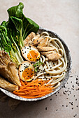 Ramen with soft-boiled eggs, Chinese cabbage, noodles, mushrooms and chicken