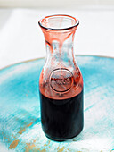 Red wine sauce in a glass carafe