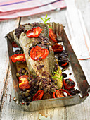 Baked fish with tapenade and tomatoes