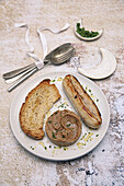 White sausage with chestnut puree, honey, and toasted bread