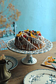 Bundt cake with sugar icing and candied fruit