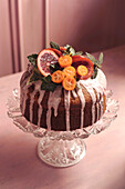 Blood orange cake decorated with icing and fruit