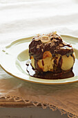 Large chou bun garnished with vanilla ice cream,warm chocolate sauce
