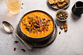 Pumpkin soup with crushed Biscotti and pumpkin seeds