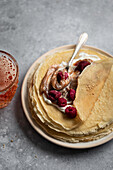 Crêpes with chestnut cream and raspberries served with a glass of cider