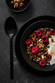 Breakfast with yogurt, raspberries and granola