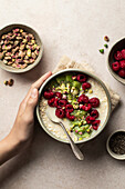 Porridge with oat flakes,kiwi,pistachios and raspberries