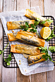 Sardines with lemon, coriander and pine nuts in brick pastry