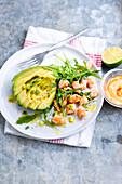 Salad with avocado, prawns, rocket, spring onions and spicy mayonnaise