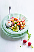 Radish, cucumber, shrimp and spring onion salad with yogurt and chili pepper sauce