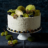 Layered cake with lush green fruit decoration