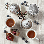 Blueberry muffins served with tea