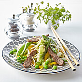 Beef with vegetables cooked in a wok (Thailand)