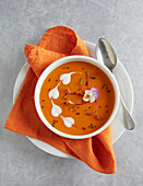 Pumpkin soup decorated with cream hearts