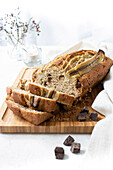 Sliced banana bread on a wooden chopping board
