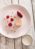Foie gras terrine with candied cherries and a quenelle of pomegranate compote
