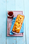 Pour the jelly through a hole in the crust using a funnel