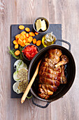 Stuffed lamb roast, tied up and cooked in a casserole dish