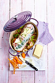 Place the veal roast stuffed with kidneys and butter in a casserole dish
