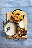 Pour the wine, stock and crème fraîche into the casserole dish
