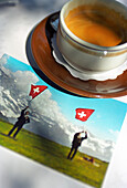 Cup of offee and typical Swiss postcard, Switzerland