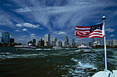American flag and skyline of Miami, Biscayne Bay, Florida, USA, America