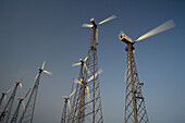 Windwheels in front of a clear sky