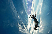 Person ice climbing at Briksdal Glacier, Norway