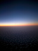 Sonnenaufgang, über den Wolken