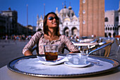 Woman enjoying a Martini at Café Florian, San Marco Place, Venice, Italy