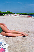 Woman' s Legs in the sunlight, Sardinia, Italy
