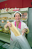 Woman selling bread, Ciabatta, italian bakery