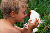 Boy with guinea pig