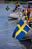 Landesfahnen, Gruvbryggan Hafen, Utö, Archipelago, Schweden