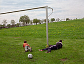 Boys playing soccer, Eifel, Germany