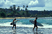 Surfer at the beach of Puerto Viejo, Caribbean, Costa Rica, Central America