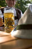 Older Bavarian man with beer stein, Munich, Bavaria