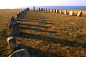 Stones on a meadow at the coast, Ales Stenar, Scania, Sweden