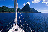 Bow of a sailing boat in front of a volcano on an island, Deux Pitons, St. Lucia, Caribbean, America